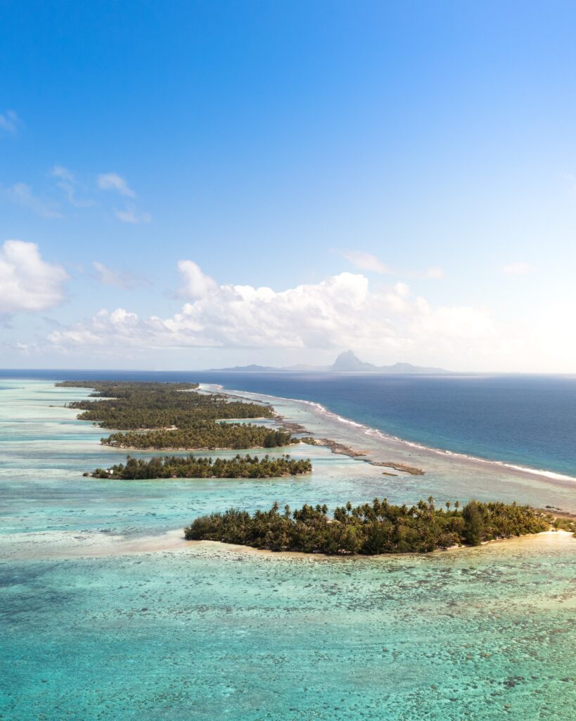 Bora Bora, French Polynesia: A Tropical Paradise With Overwater Bungalows And Crystal-clear Waters. Bora Bora, French Polynesia: A Tropical Paradise With Overwater Bungalows And Crystal-clear Waters.